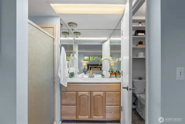 Refreshed primary bath with shower and separate toilet room.