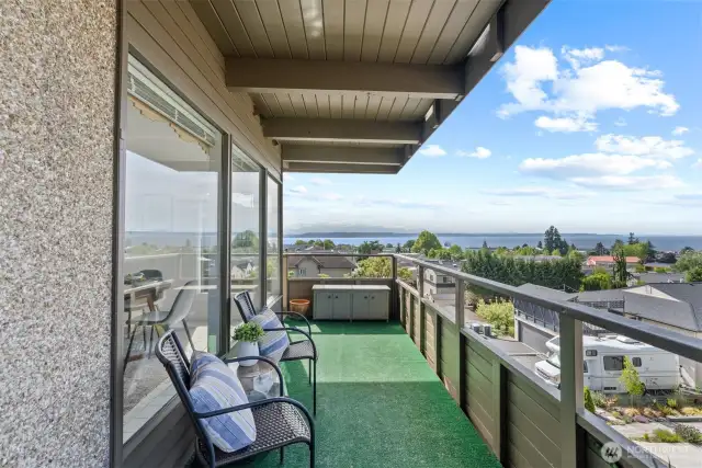 Wonderfully situated end unit with large deck, picture windows, covered parking, and more!