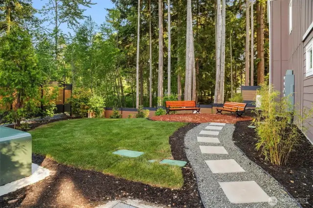 Landscaped sitting area for neighborhood enjoyment.