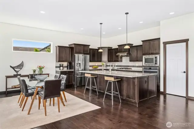 Luxurious chef’s kitchen with granite island & counter tops