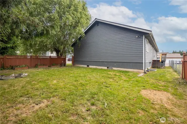 Level, fully fenced back yard.