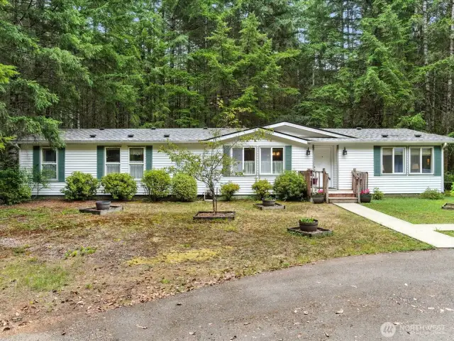 Welcome to this well-maintained manufactured home on 4.7 serene acres.