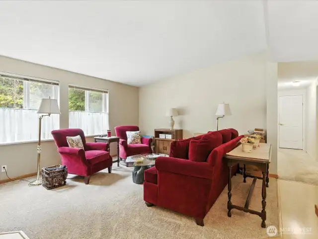 Positioned just off the entry, this inviting space features large windows that fill the room with natural light and create a welcoming first impression.