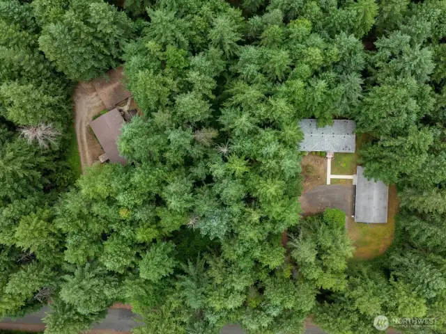This picture provides a full overview of both lots, highlighting the expansive layout and versatility of the property. You’ll see two detached garages—one of which includes finished office space