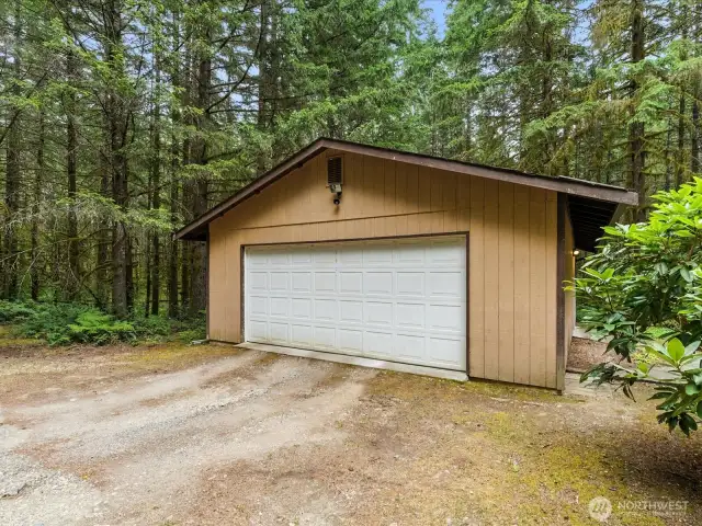 Situated on the adjacent parcel, the two-car detached garage offers more than just parking—it includes a finished office space, perfect for remote work, creative pursuits, or a quiet retreat. This versatile structure adds valuable functionality to the property, whether you need extra storage, a workshop, or a dedicated space to focus. With its own separate setting, it enhances the overall flexibility and potential of the property.