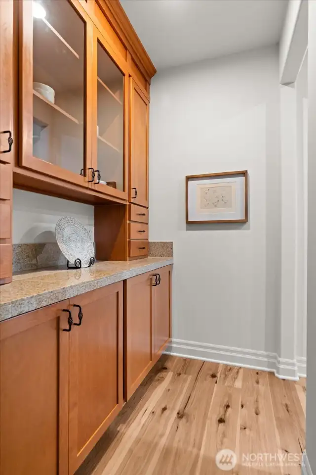 Ideal for hosting, the convenient butler's pantry acts as segue between kitchen and dining, and offers additional counter and cabinet space