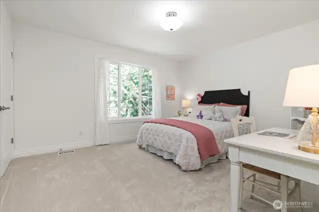Extra large secondary bedroom could accommodate king or queen size bed and dresser, and offers front yard views