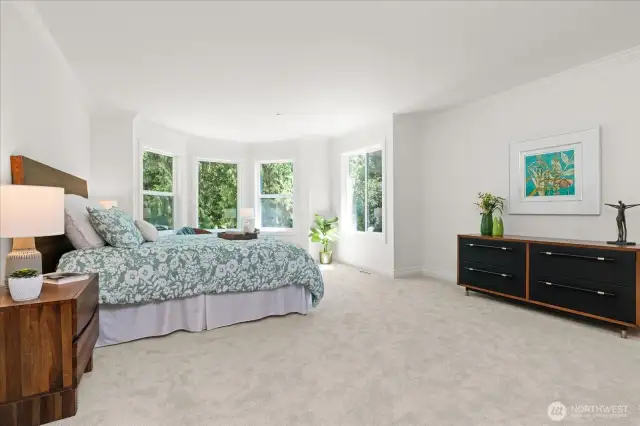 Considerable primary suite with quaint sitting area can easily accommodate a king size bed, and dresser