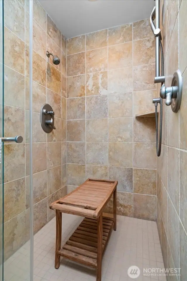 Large walk-in shower with dual shower in primary bath