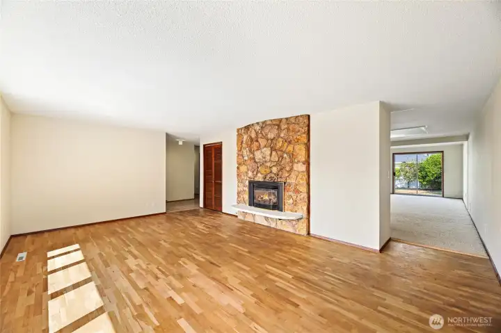 LIVING ROOM  Beautiful original hardwoods floors  Gas fireplace with natural cut stone edge hearth and flat rock accent wall