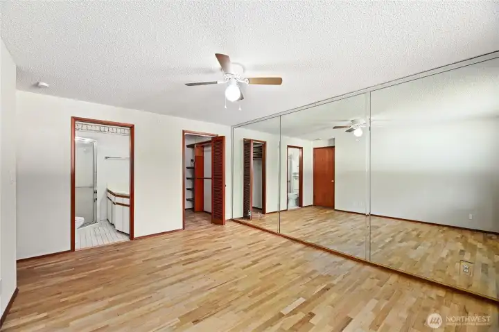 PRIMARY BEDROOM  Wall to wall mirror / Ceiling fan  Window overlooking rear yard  Beautiful original hardwoods floors