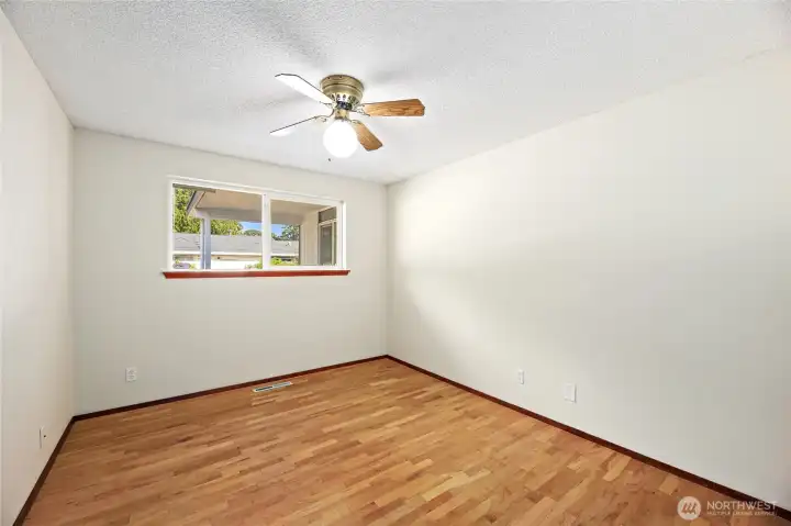 BEDROOM #3  Windows overlooking rear yard  Ceiling fans / Closet with slider door  Beautiful original hardwoods floors