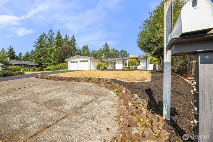4 car parking in driveway (with sensor lights) plus small RV or car parking off street in front of home