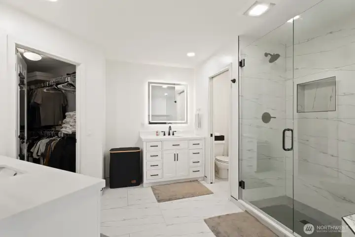 Large format tiled floor and large walk-in closet.
