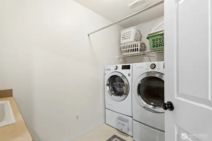 Laundry room with a sink conveniently located upstairs.