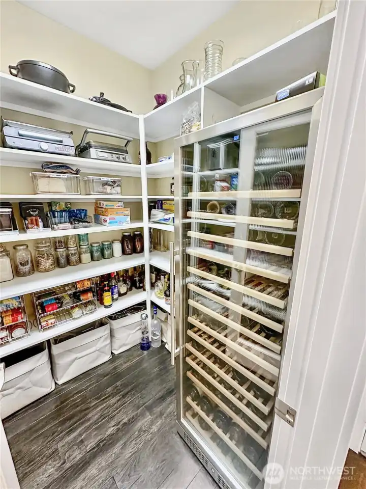 Huge Pantry offers tons of storage and wine refer.