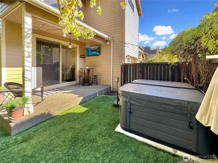 Sit in the hot tub and enjoy watching your favorite team play.  Great covered area just off of great room.