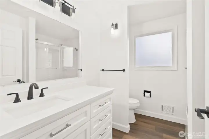 Full bath is bright and new and ready for you