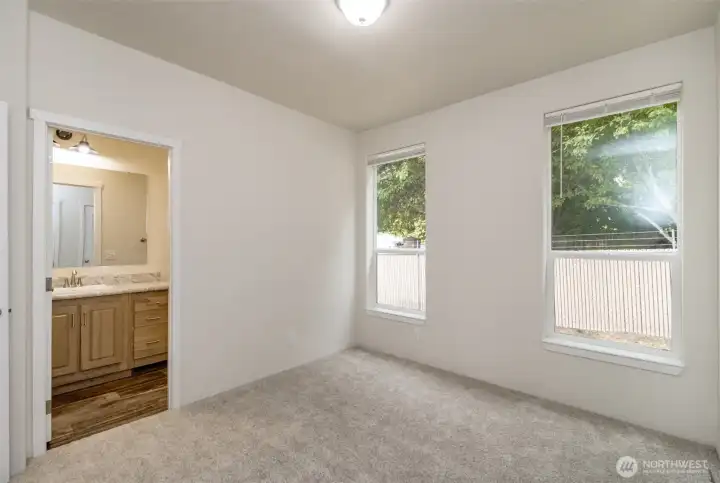 Primary bedroom with three quarter bath