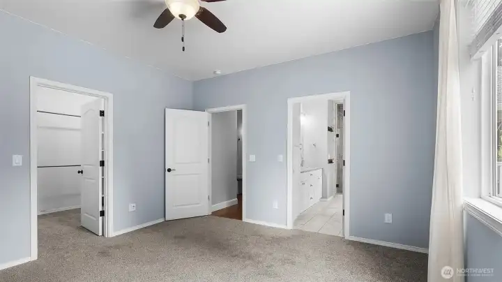 Primary Bedroom - Main Floor with view of walk-in closet