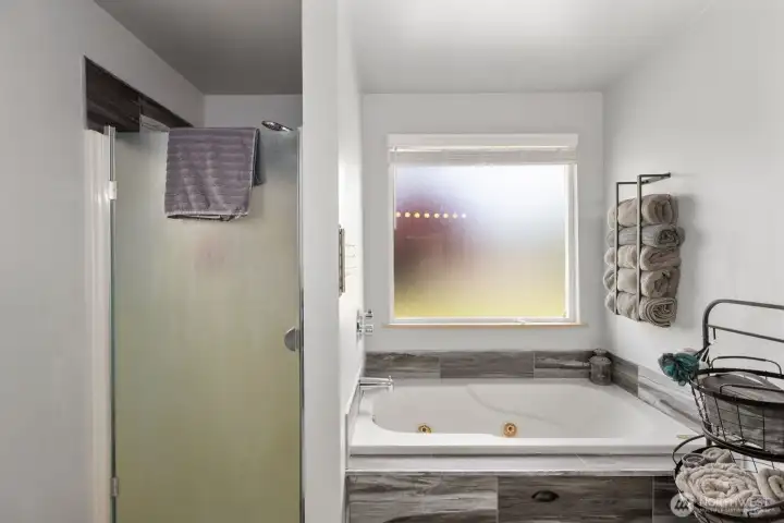 Shower stall and jetted tub
