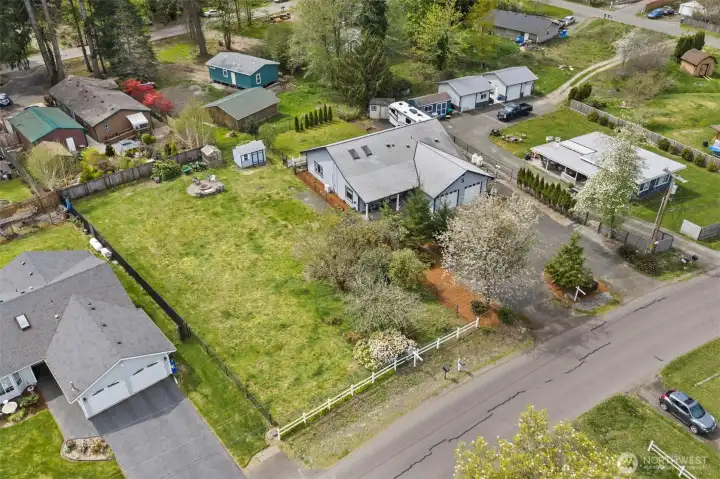 Aerial view showing orchard in front. Shed and firepit stay. Aerial view showing orchard in front. Shed and firepit stay.