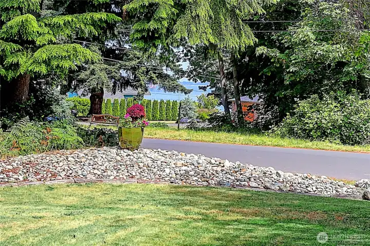 Partial water views in Summer ~ More view when deciduous trees drop their leaves.