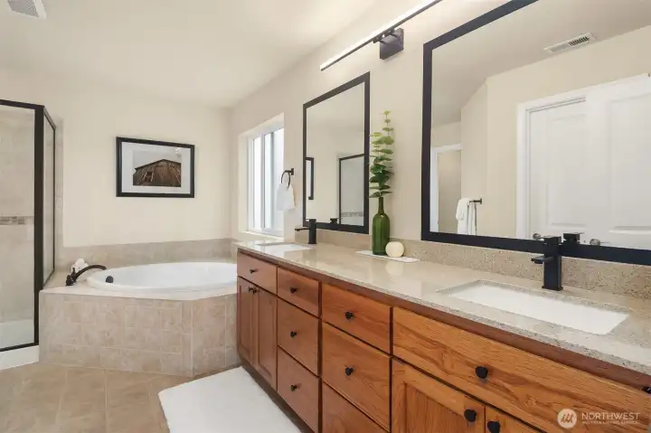 The primary bathroom is a relaxing escape with soaking tub, dual vanities and walk-shower. The primary bathroom is a relaxing escape with soaking tub, dual vanities and walk-shower.