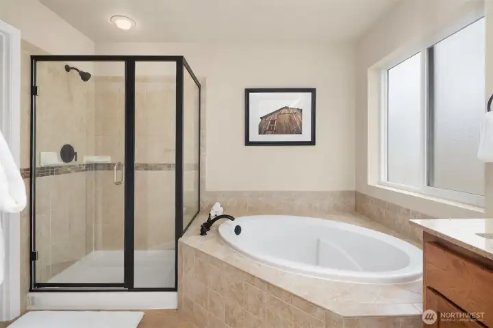 Relax and get swept away in the soaking tub or walk-in shower. Relax and get swept away in the soaking tub or walk-in shower.