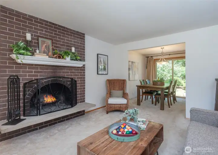 The dining area flows seamlessly from the living room into the kitchen, creating a functional layout that is ideal for both everyday living and entertaining.