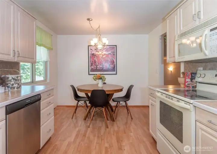 The home offers both a formal dining space for entertaining and a charming kitchen nook that is ideal for morning coffee and everyday dining.