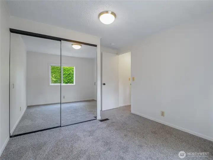 New mirrored closet doors makes the room feel larger. New mirrored closet doors makes the room feel larger.