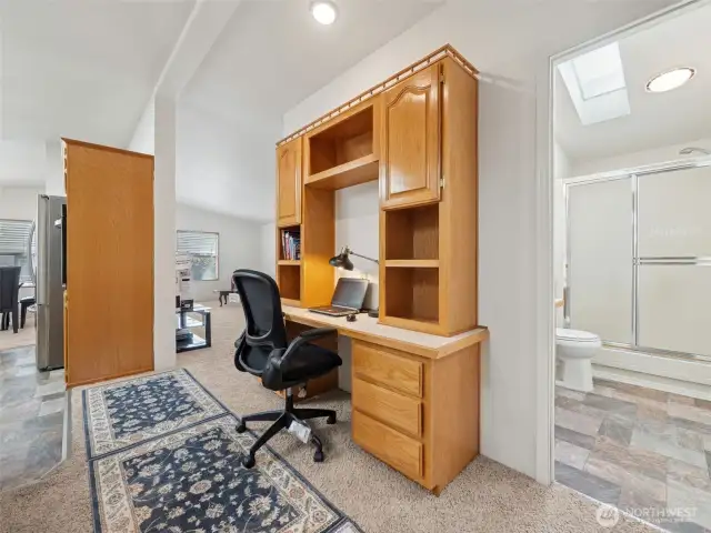 As you enter from the carport, you pass through the utility room into the main hallway. A really nice space for an office, kitchen and dining to your hard left, living room straight ahead and kids/guest 3/4 bath to your right.
