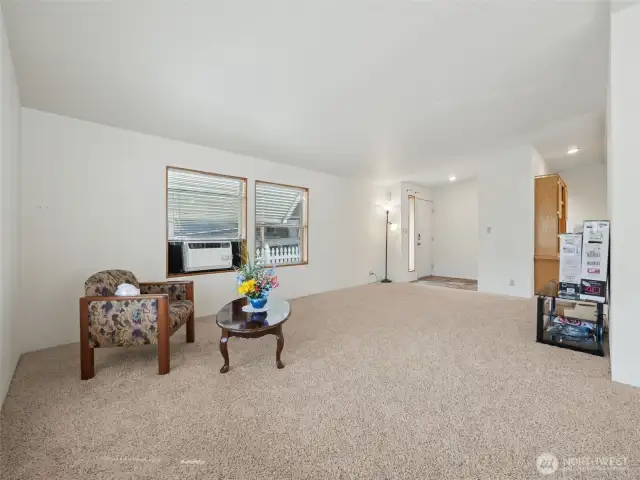 As you enter from the other side of the home, you will find this LARGE living room! Window A/C is included for those warmer days.