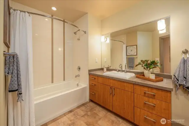 Large full bath with granite counter tops.