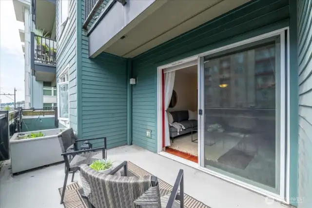 Balcony space with large planters to add greenery and privacy.