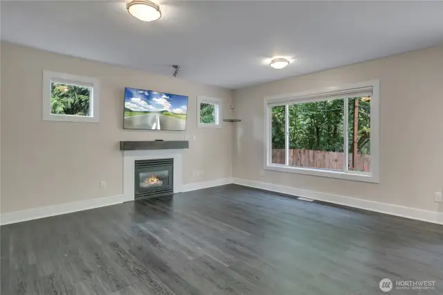 Large windows flood this home with natural light from every angle
