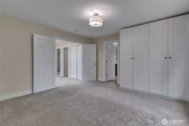 Primary suite upstairs with built in wardrobe