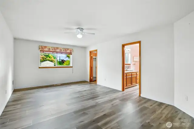 Primary bedroom with views to backyard