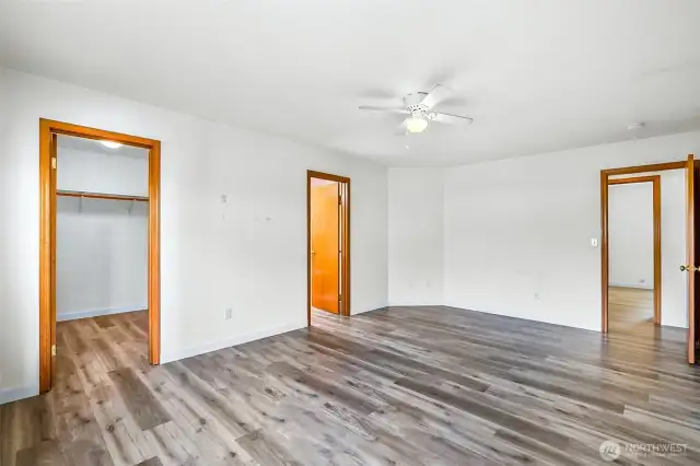 Primary bedroom with walk-in closet and private bath
