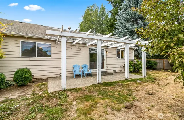 Back of home showing patio