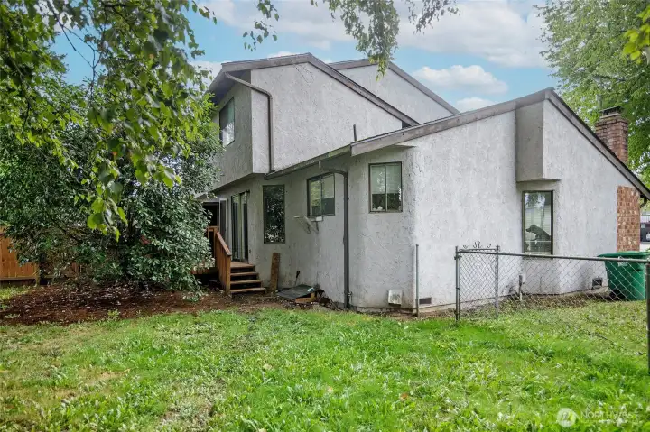 Spacious fully fenced backyards with decks for both units.