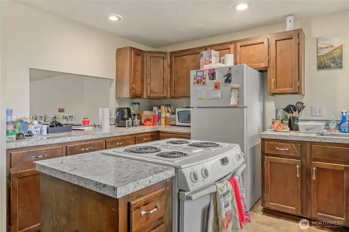Large kitchens with lots of counter space. Half bath and separate laundry space off kitchen with slider to the deck and back yard.