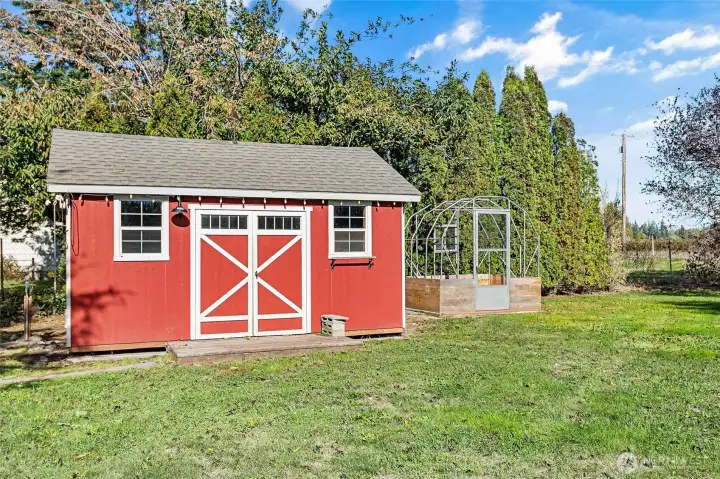 Outbuilding 1 has a manual awning. Greenhouse next to it just needs covering.
