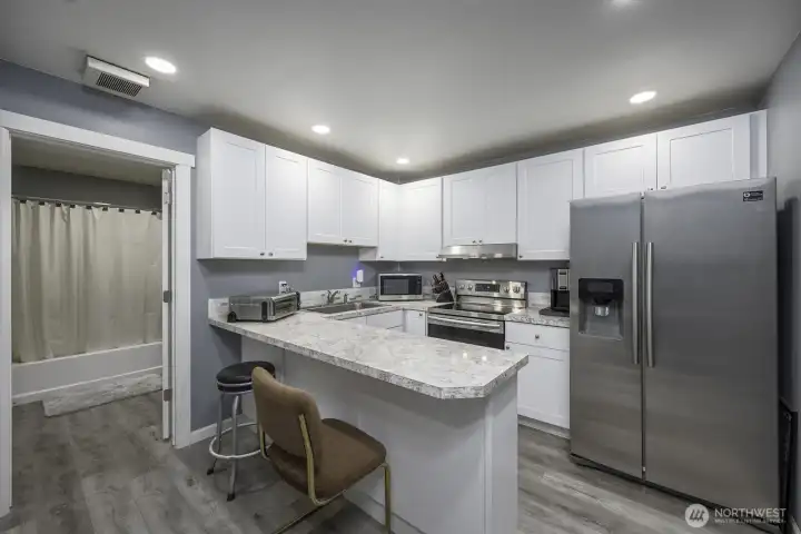 Comfortable kitchen and full bathroom on the first floor of the Shop ADU.