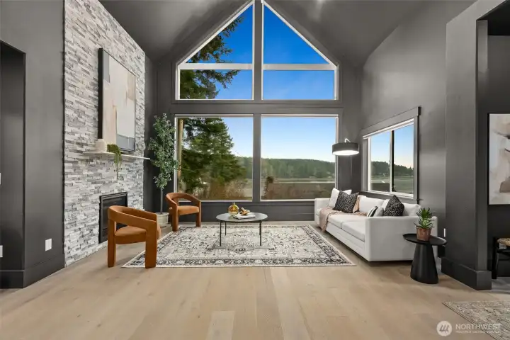 Gorgeous windows invite abundant natural light and showcase breathtaking Pacific Northwest scenery.