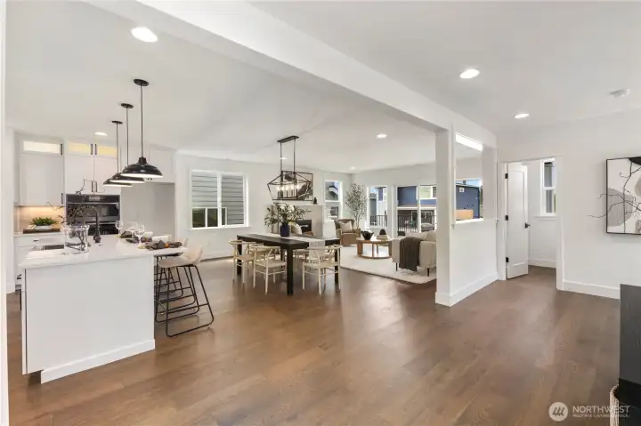 Open Main Level: Expansive open-concept design seamlessly connects the kitchen, dining, and living areas with natural light flowing throughout. Perfect for both casual gatherings and larger celebrations, this layout makes entertaining effortless.  These photos are of the actual, staged home being sold at Foxmoore. However, all photos, renderings, site maps, and floorplans are for visualization purposes only. Plans, colors, building orientation, finishes, home outlook, and other details can and WILL vary.