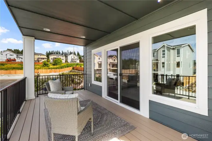 Covered Deck: Outdoor living is made easy on the covered deck, with space for seating and views of the neighborhood. This private extension of the great room invites year-round enjoyment.  These photos are of the actual, staged home being sold at Foxmoore. However, all photos, renderings, site maps, and floorplans are for visualization purposes only. Plans, colors, building orientation, finishes, home outlook, and other details can and WILL vary.