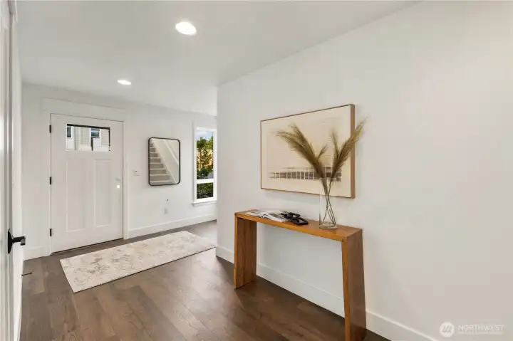 Lower Level Entry/Foyer: A welcoming entry with wide-plank flooring and natural light sets the tone for the home’s modern design. Clean lines and thoughtful finishes create a fresh, inviting first impression.  These photos are of the actual, staged home being sold at Foxmoore. However, all photos, renderings, site maps, and floorplans are for visualization purposes only. Plans, colors, building orientation, finishes, home outlook, and other details can and WILL vary.