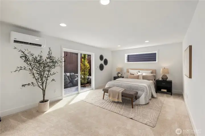 Lower-Level Bonus / Bedroom: This spacious lower-level flex room offers versatility as a guest suite, recreation area, or home office. Large windows and sliding glass doors provide abundant natural light and direct access to the private patio.  These photos are of the actual, staged home being sold at Foxmoore. However, all photos, renderings, site maps, and floorplans are for visualization purposes only. Plans, colors, building orientation, finishes, home outlook, and other details can and WILL vary.